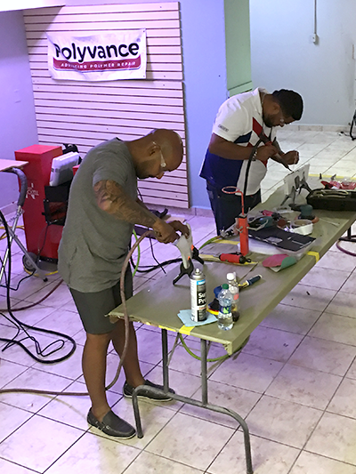 Two men using the nitrogen plastic welder