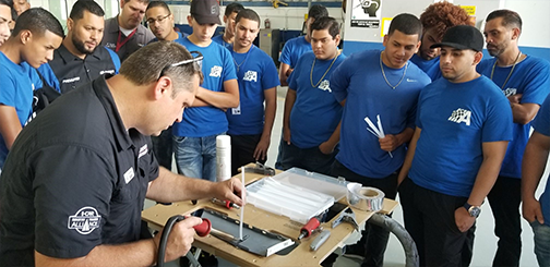 John welding with the nitrogen plastic welder to show college students how it works.